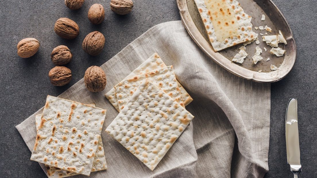 top view of matza and walnuts on concrete table, jewish Passover holiday concept