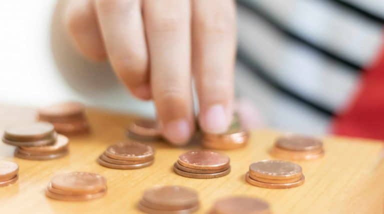 Hand and coin stacking
