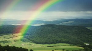 green-meadow-with-rainbow-in-spring-4N8ZPL6-scaled-e1633341117862