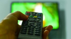 watching-tv-and-using-remote-controller-AT3LV9L-e1619335024350