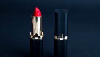 two beautiful lipsticks on the black background